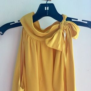 Soft-yellow high neck blouse with tie