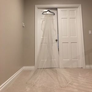 Cathedral length ivory veil with satin piping