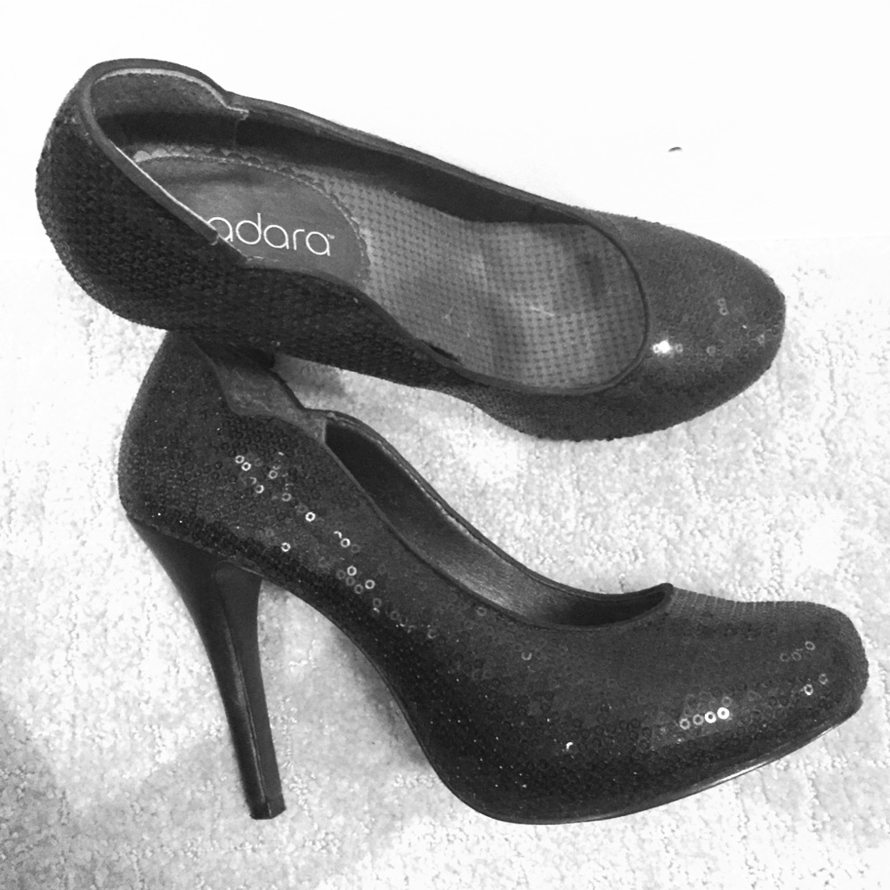 Black sequin pumps