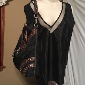 Black blouse with mesh and piping around neck