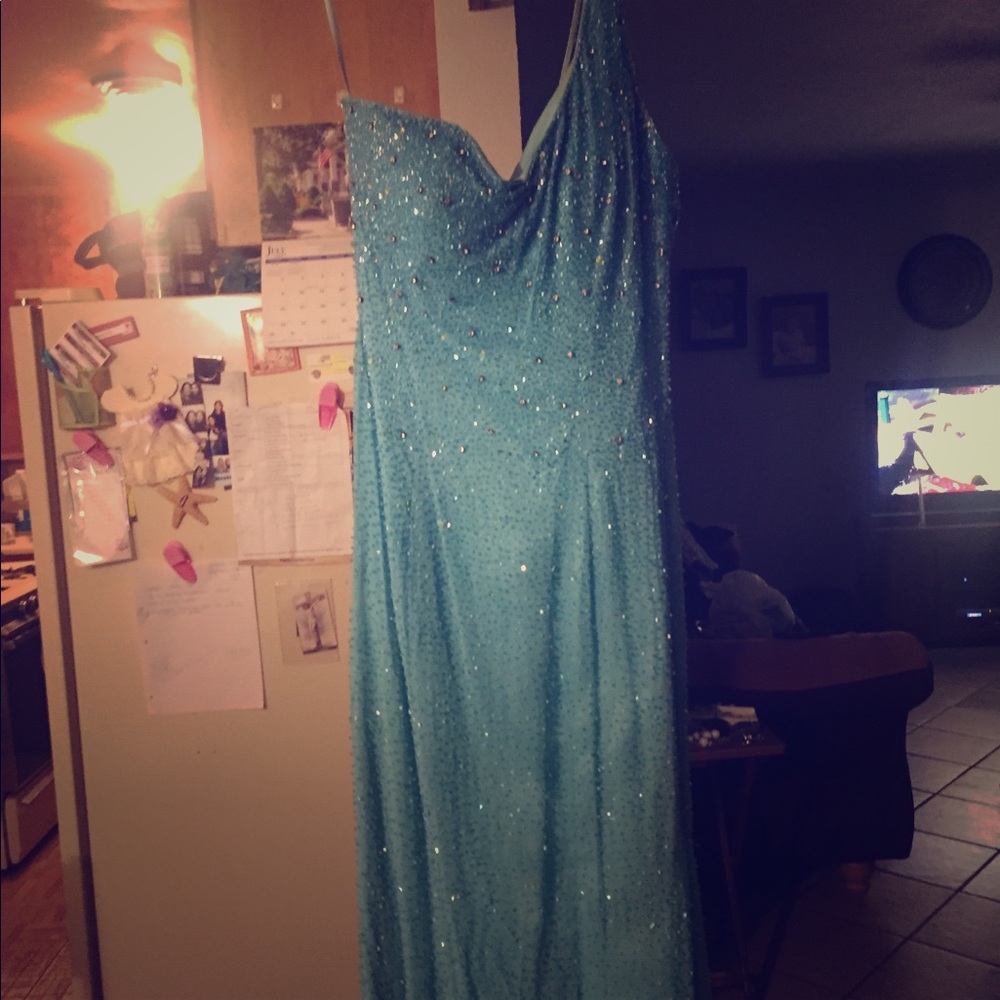 One shouldered fully beaded gown.