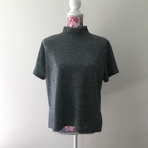 Periphery women’s mock back zip gray top