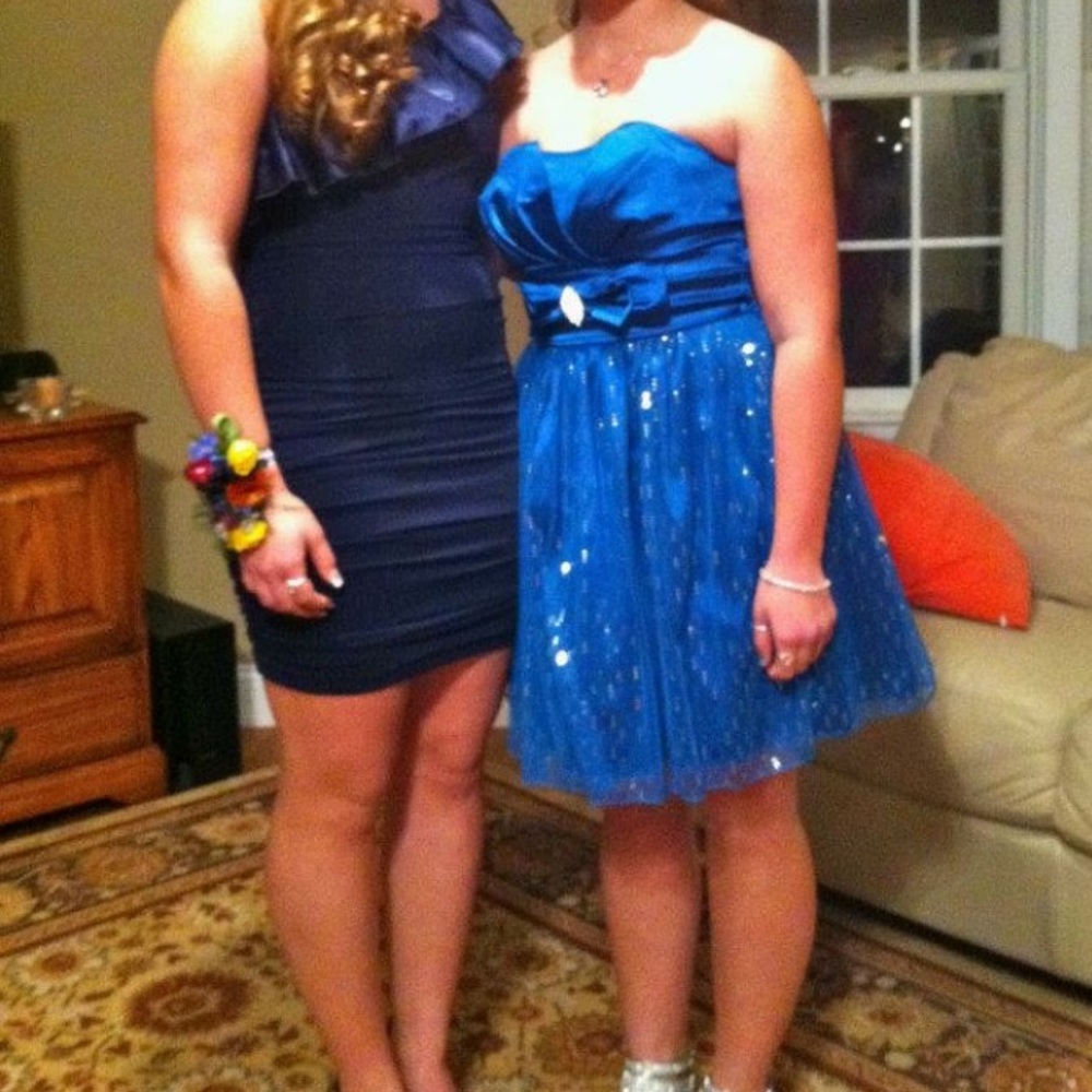 Dress on left! Darker blue- the other one is also
