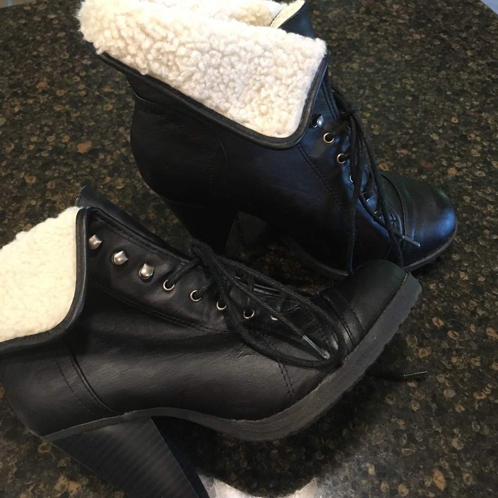 Heeled lace up combat boots with fur cuffs