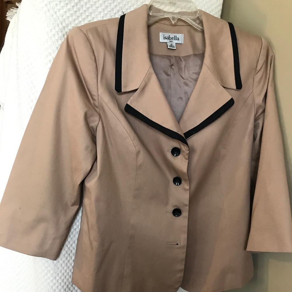 A tan and black trim to blazer.