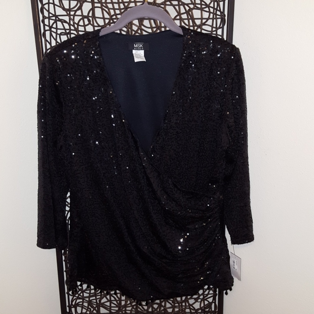 Black sequin top with beading on the bottom.