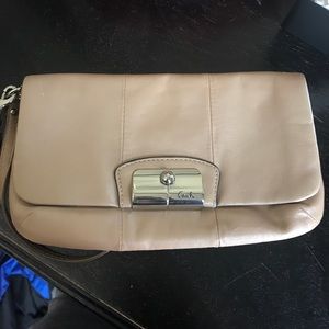 Coach wristlet. Tan with coral interior.