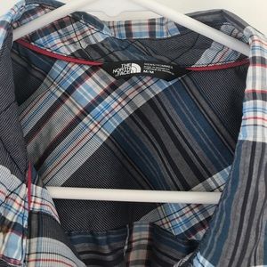 The North Face plaid button down shirt.