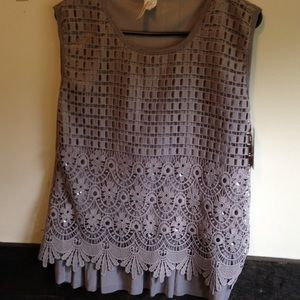 Grey, detailed top by Universal Fashion.