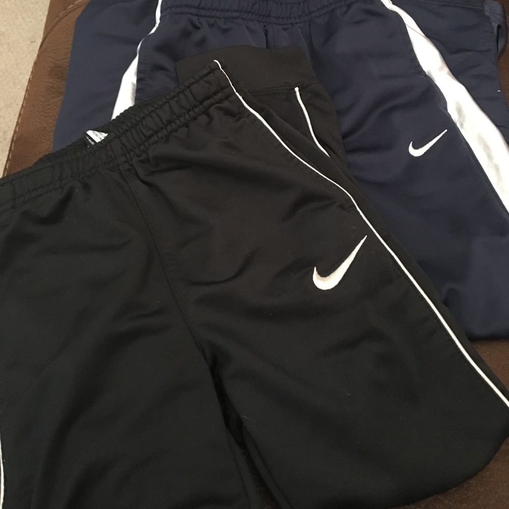 2 pairs of Nike Nylon pants!