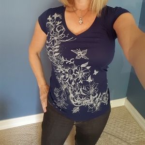 Blue t shirt  with pale gray floral design