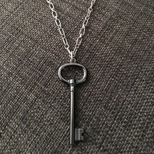 Oval chain with titanium key pendant