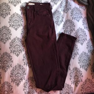 Maroon ripped skinny jeans