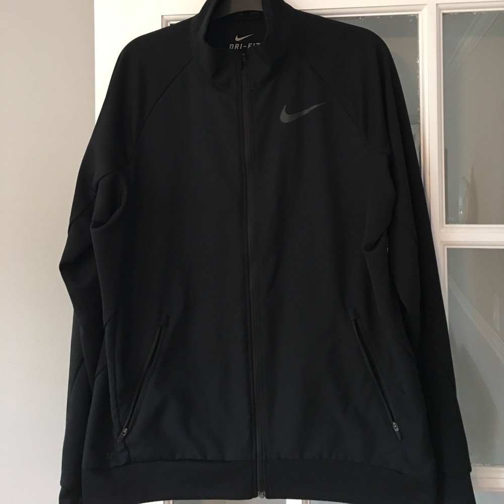 Black Nike dri fit zip up jacket.