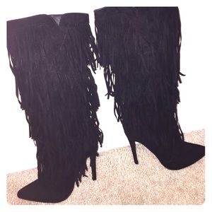 Black heeled ruffle boots