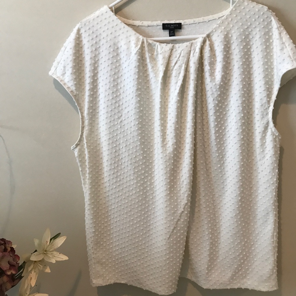 Ivory pullover with subtle raised polka dots.