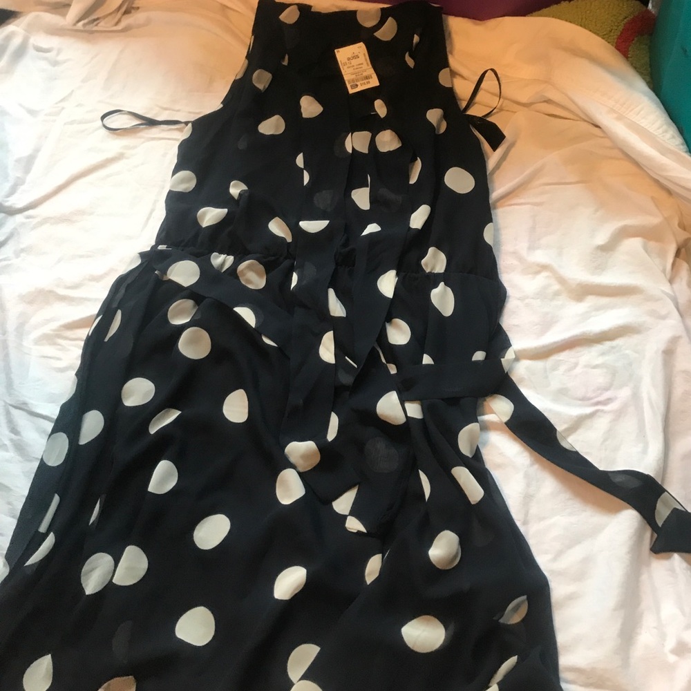 Ties at the waist, comes with a poka dot tie