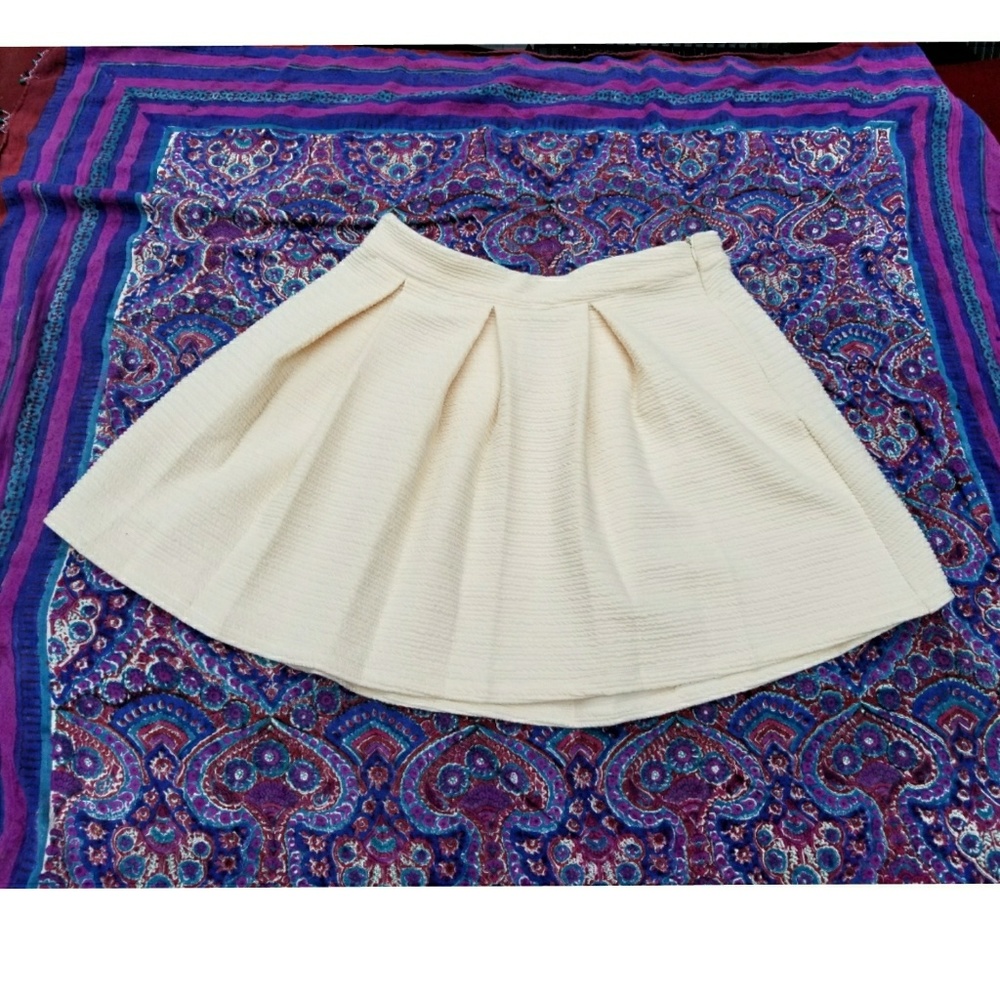 Textured,  pleated skirt.