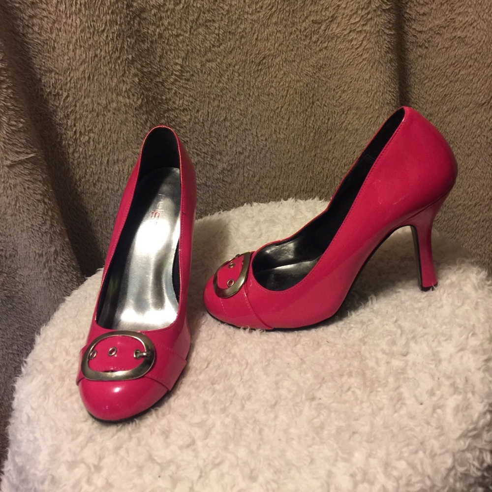 Hot pink belted pumps.