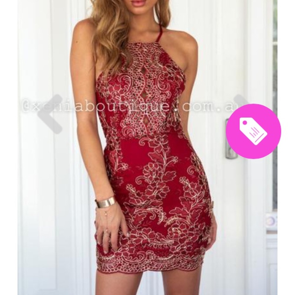 Tight red dress with deep red and gold details