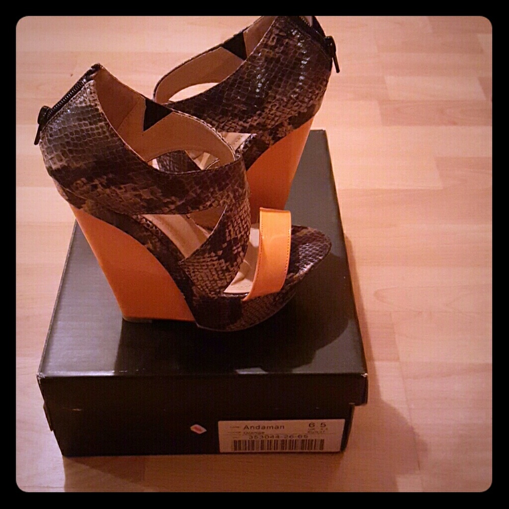 Light orange and  black snake skin wedges