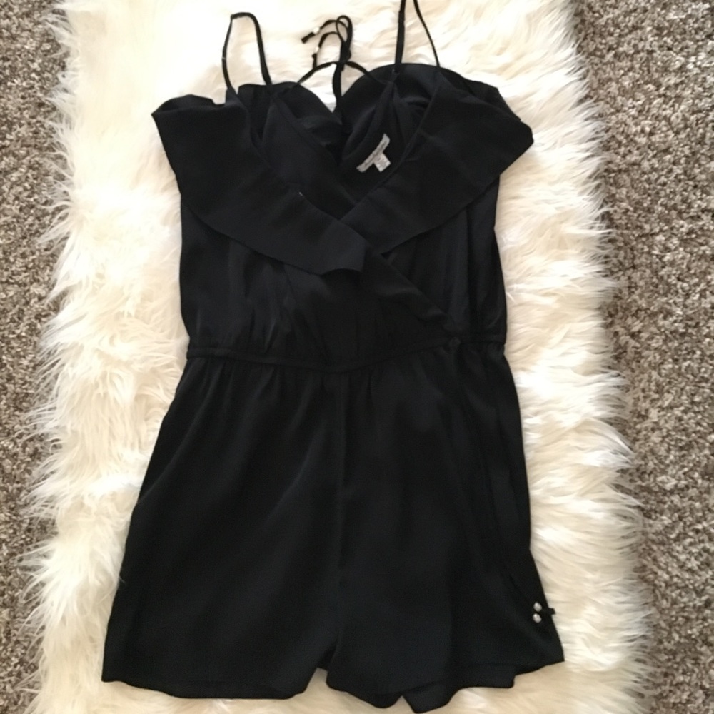 Black ruffled romper