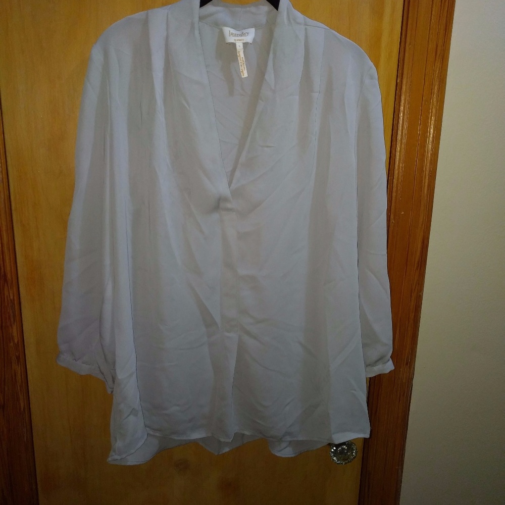 Light blue blouse with deep neckline