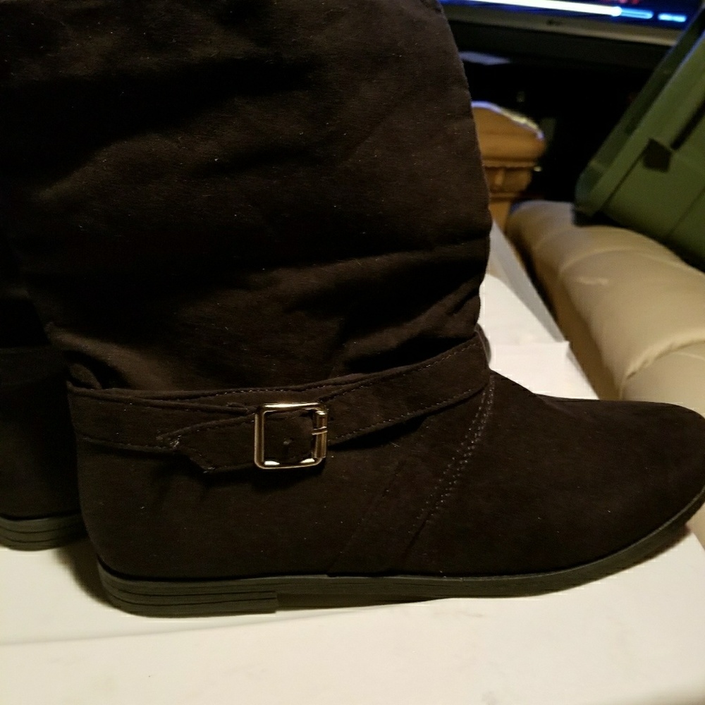 Black boots with side buckles