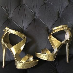 Nine West gold platform strapped pump.
