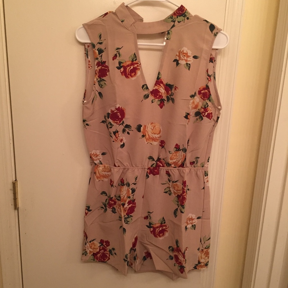 tan floral romper with cut out in front