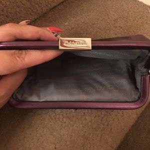 Purple Calvin Klein clutch  with silver accent