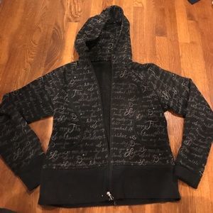 Black zip up hoodie with positive words