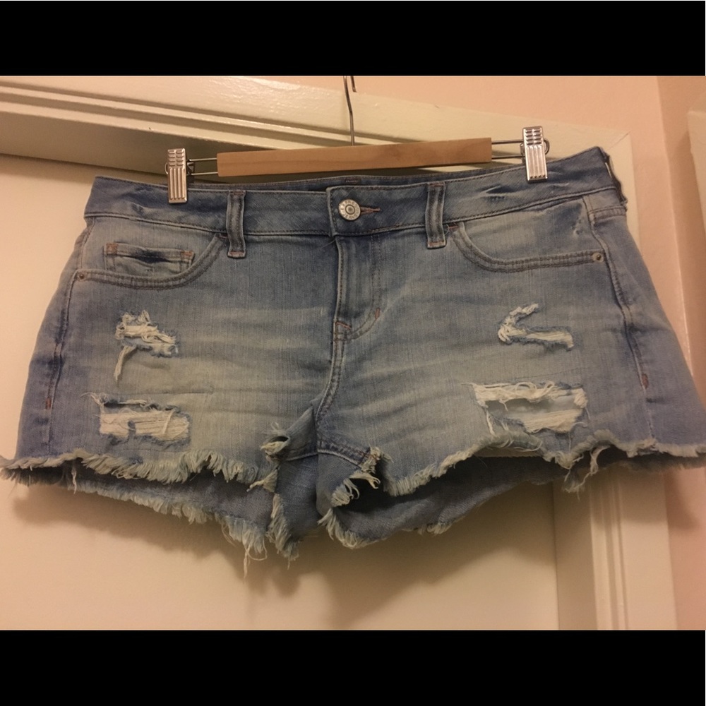 Low rise distressed denim shorts
