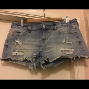 Low rise distressed denim shorts