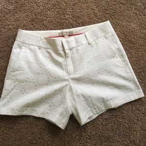 White, patterned shorts.