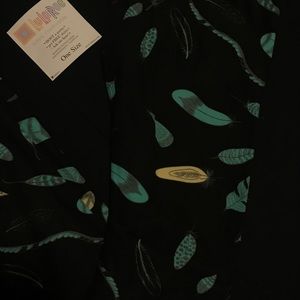Lularoe feathers os black background