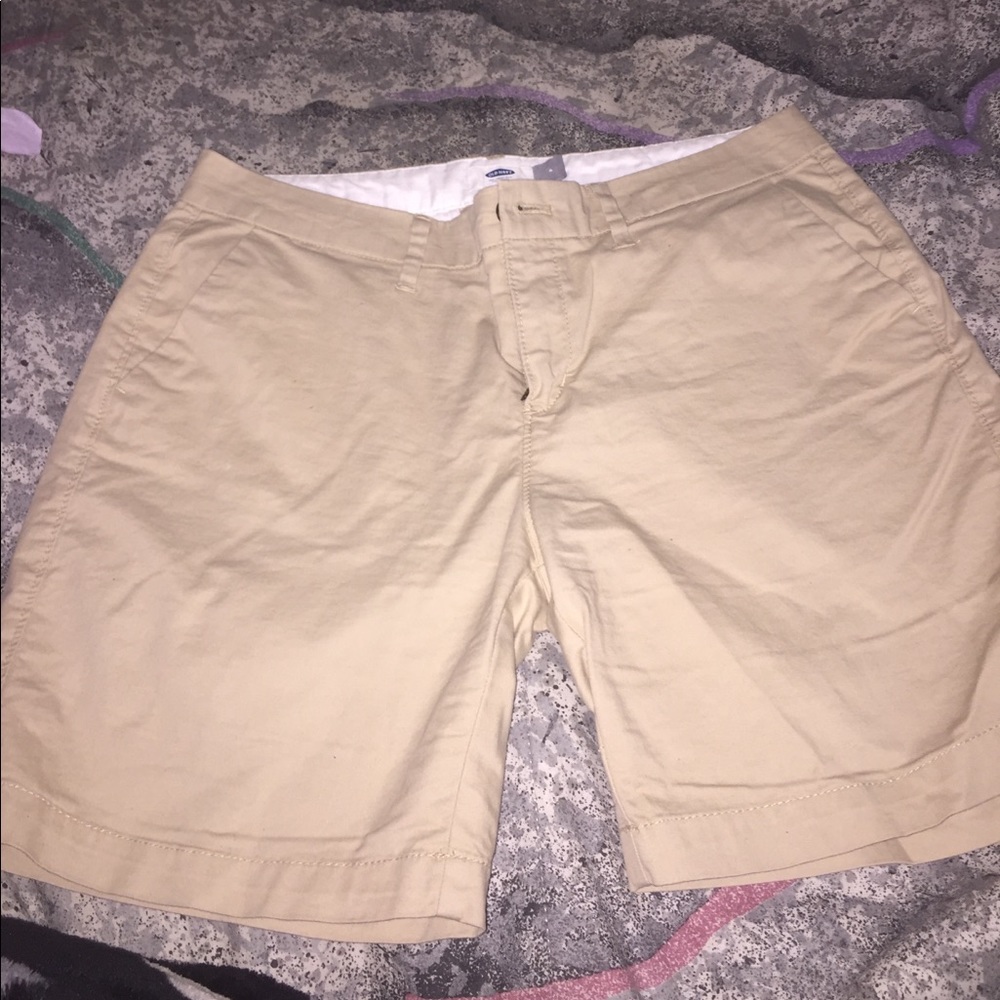 Tan colored shorts.
