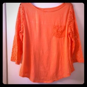 Beautiful peach top with lace sleeves and back.