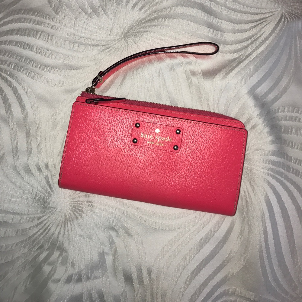 Neon coral wristlet style wallet by Kate Spade!