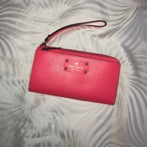 Neon coral wristlet style wallet by Kate Spade!