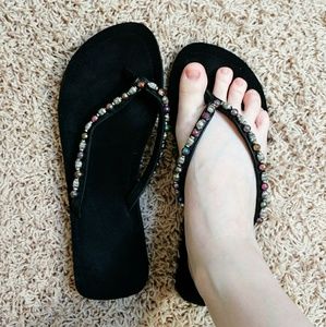Beaded black flip flops
