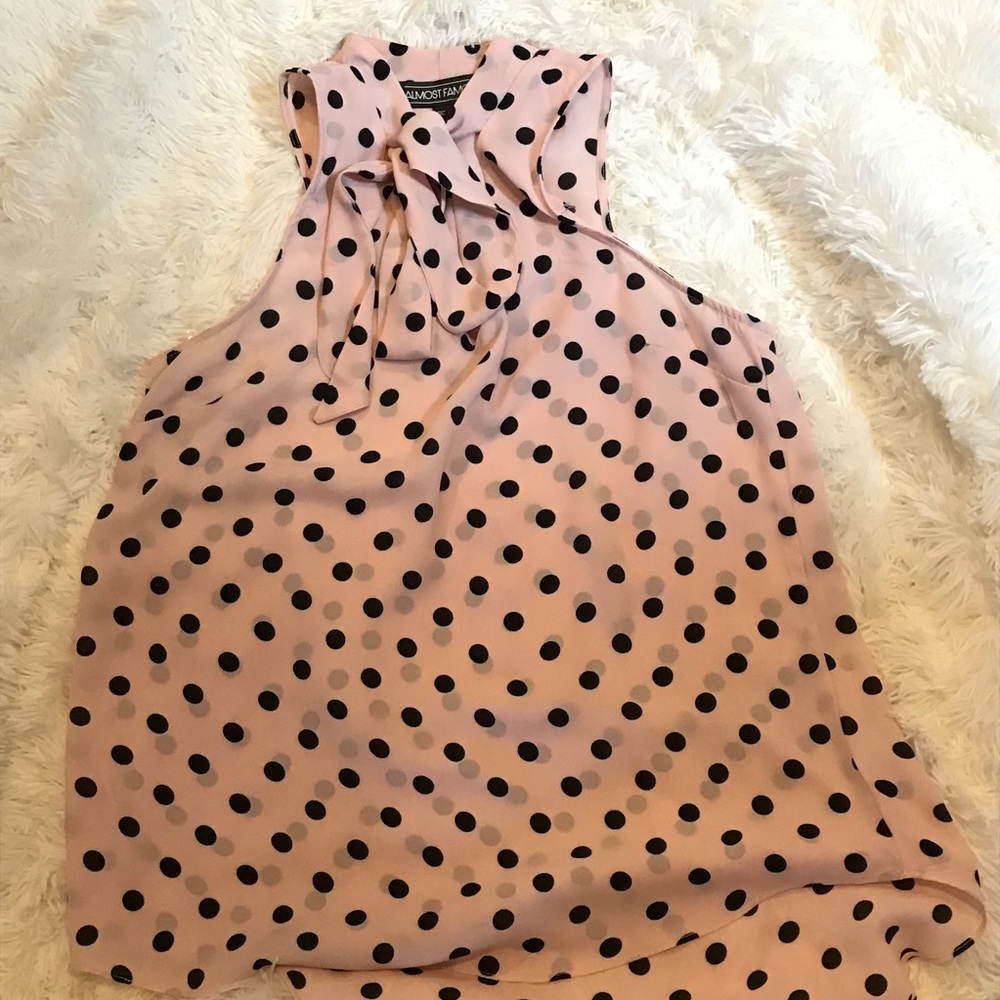 Pink and black polka dot sleeveless top