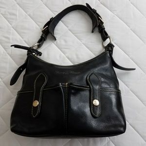 Black medium sized Dooney & Bourke leather purse.