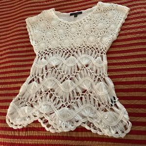 Hand knit short sleeve top.