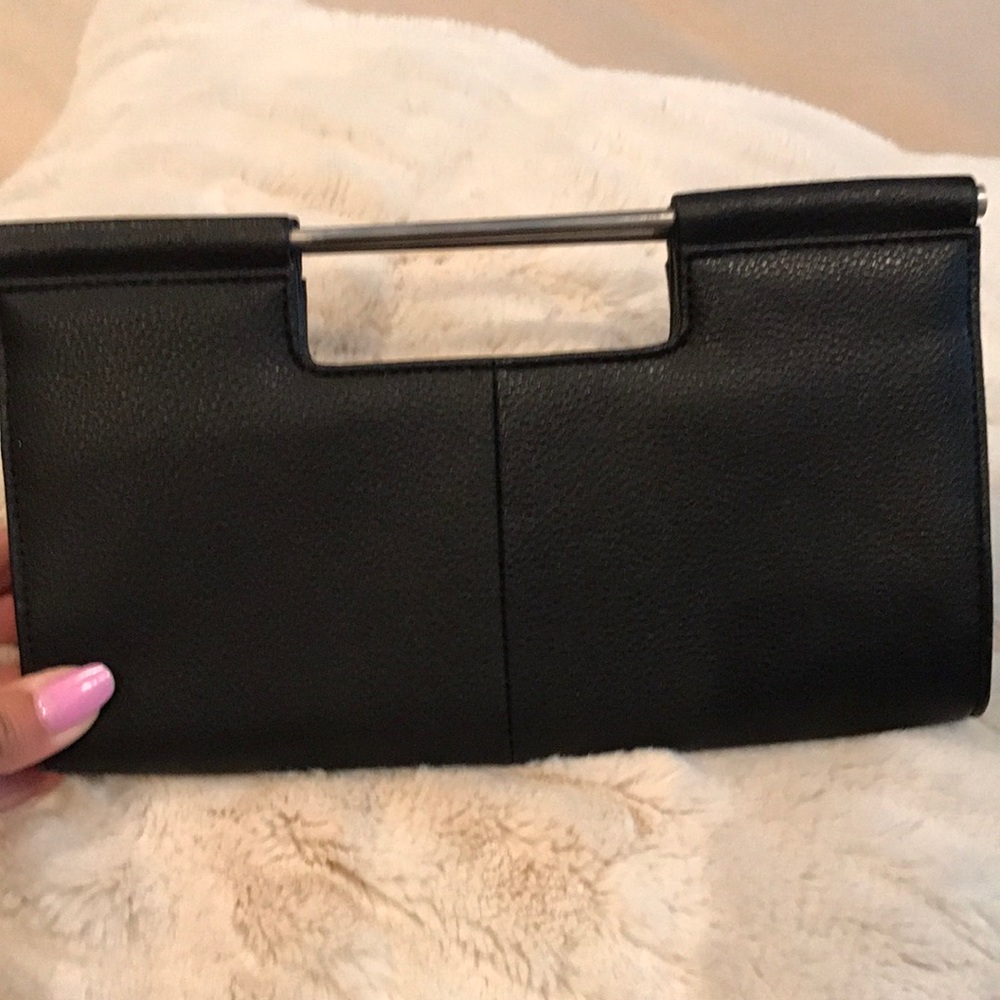 Small, black leather clutch 👛