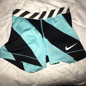 Black and blue striped nike pros
