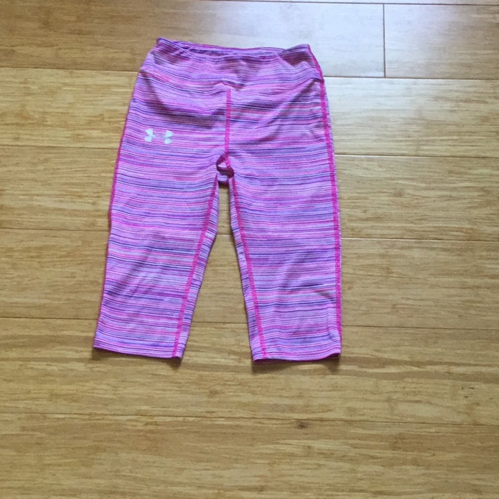 Pink and purple under armor Capri leggings.