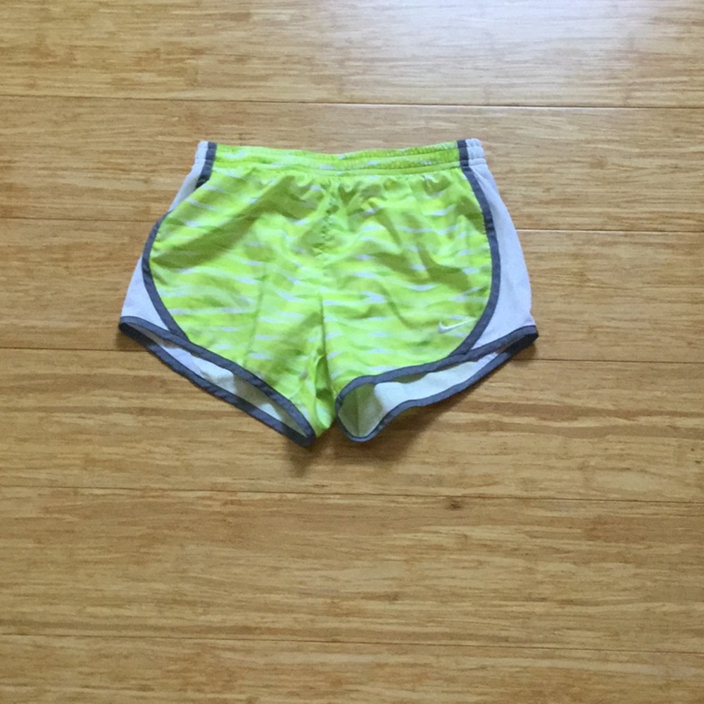 Green and white Nike shorts