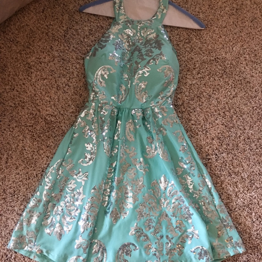 turquoise dress with silver sequin designs