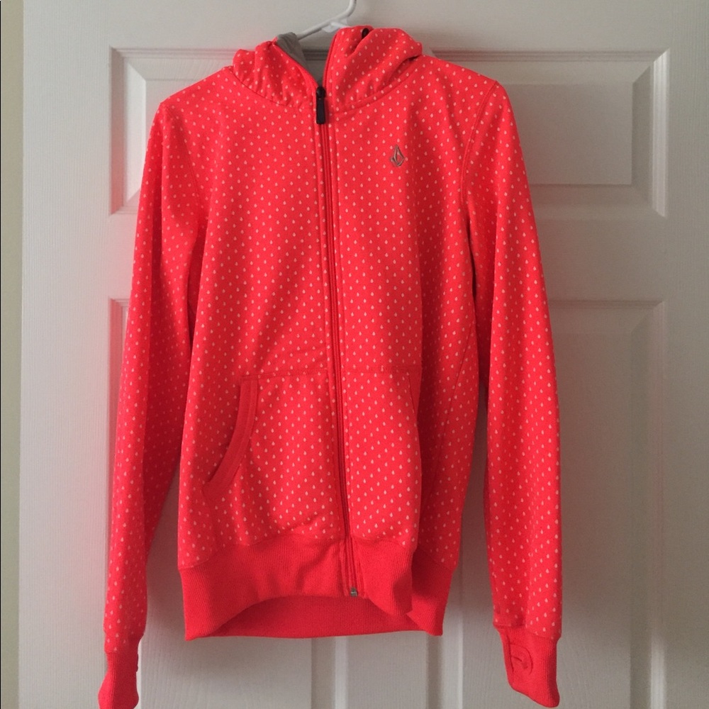 Bright neon pink/orange jacket.